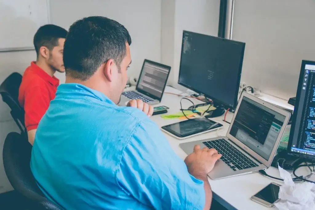 People collaborating on digital asset market research
